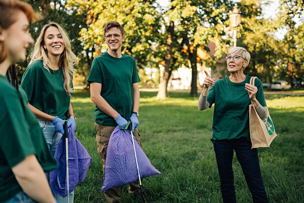istock Volunteers collecting trash in park during community cleanup event 2218780276