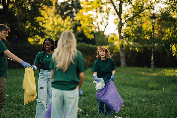istock Volunteers collecting trash in a public park 2218780349
