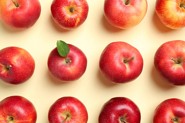 istock Many red apples on beige background, flat lay 2218781054