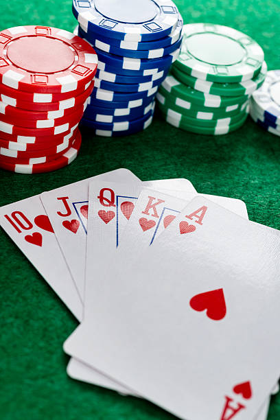 istock Royal flush and gambling chips on gambling table 2218781108