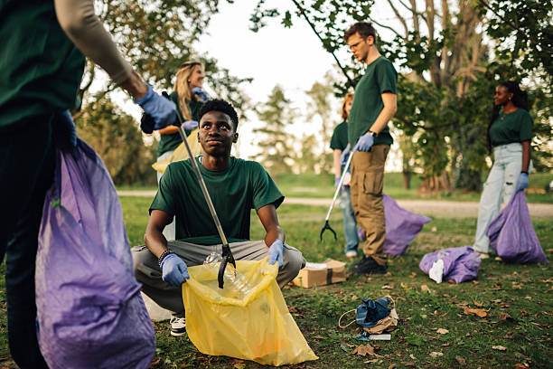 istock Volunteers picking up trash in a public park 2218781149