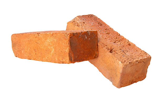 istock Side view of two cracked old red or orange bricks in stack isolated on white background with clipping path 2218782315