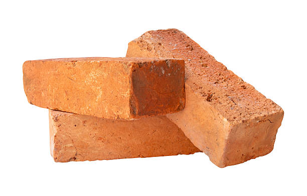 istock Side view of three cracked old red or orange bricks in stack isolated on white background with clipping path 2218783108