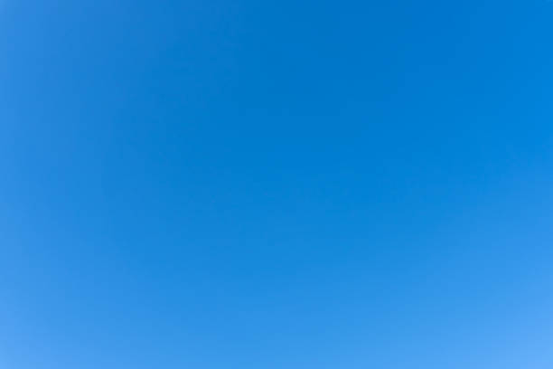 istock Low angle view and full frame of beautiful light blue sky without clouds in the morning or afternoon on sunny day used as natural background texture in decorative art work 2218783195