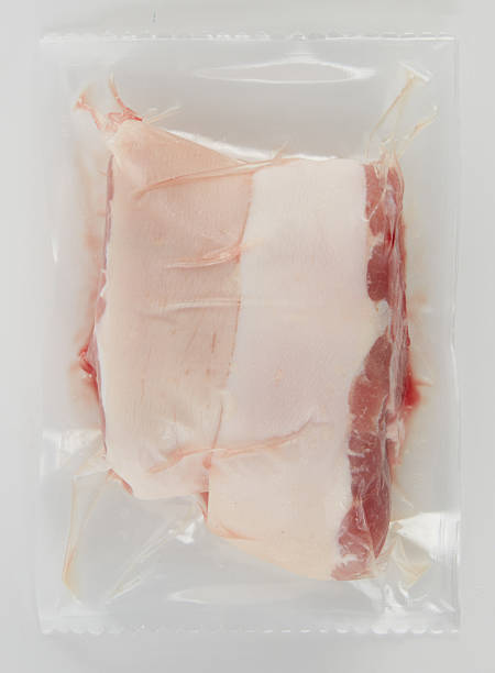 istock Fresh pork belly in plastic bag isolated nature background with clipping path 2218784441