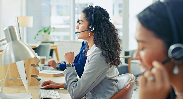 istock Customer Service Representatives Working Professionally in a Bright Office Environment 2218785775
