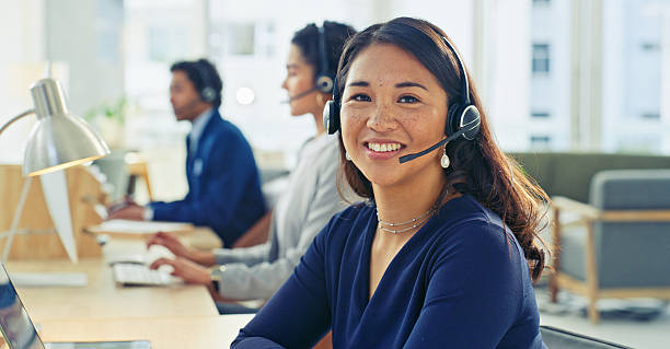 istock Young Professionals Working in Modern Office With Headsets 2218785777