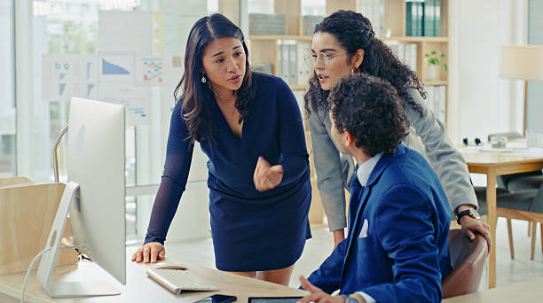 istock Diverse Team Discussing Business Strategies in Modern Office Setting 2218785793