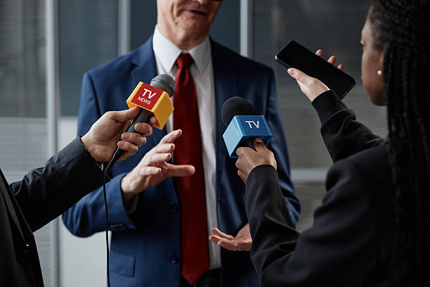 istock Middle Aged Caucasian Man Giving Interview to Multiethnic Journalists Indoors 2218789315