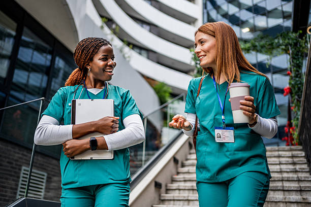 istock Nurses walking and talking outside hospital 2218791445