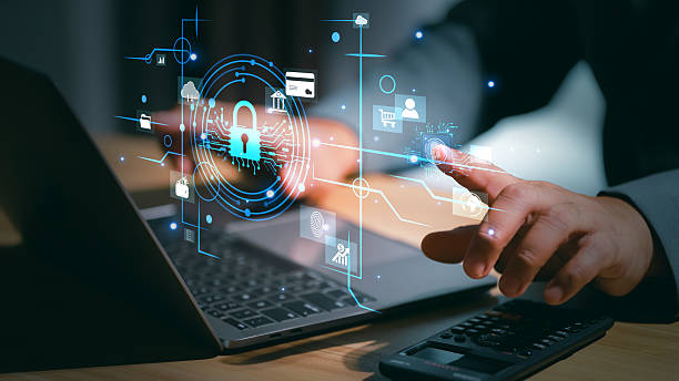 istock Cybersecurity protection concept with a hand touching a glowing padlock and shield icon, representing data security, encryption, and secure digital access in a high-tech environment. 2218791747