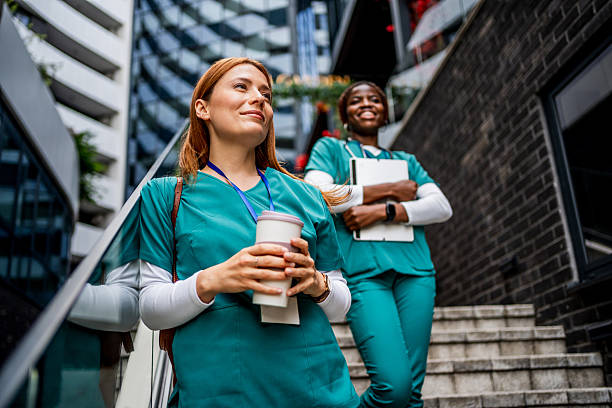 istock Two nurses enjoying a coffee break outside the hospital 2218792299