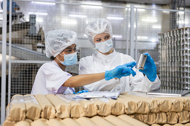 istock Food Safety Inspectors Examining Tin Can Quality 2218795537