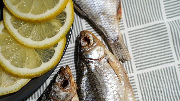 istock Dried Fish with Lemon Slices and Vodka Glasses 2218800120