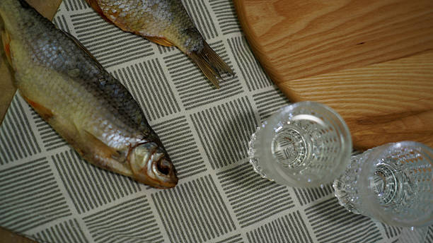 istock Traditional Dried Fish with Glasses of Vodka on Table 2218800263