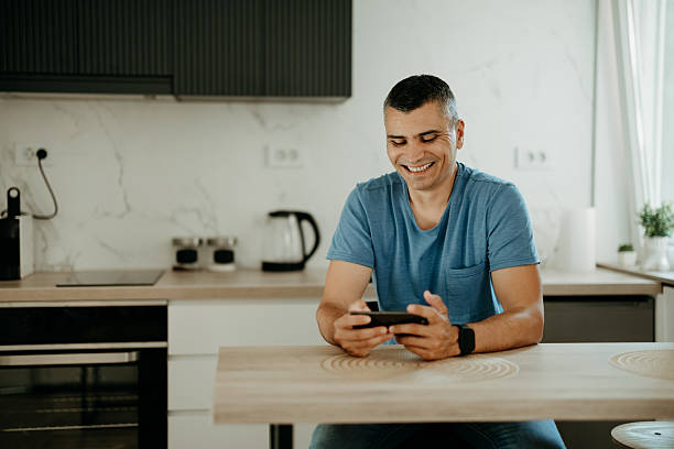 istock Man playing video games on his smartphone 2218801137