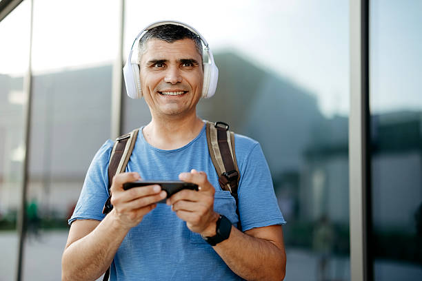 istock Man plays games on his mobile phone 2218801169