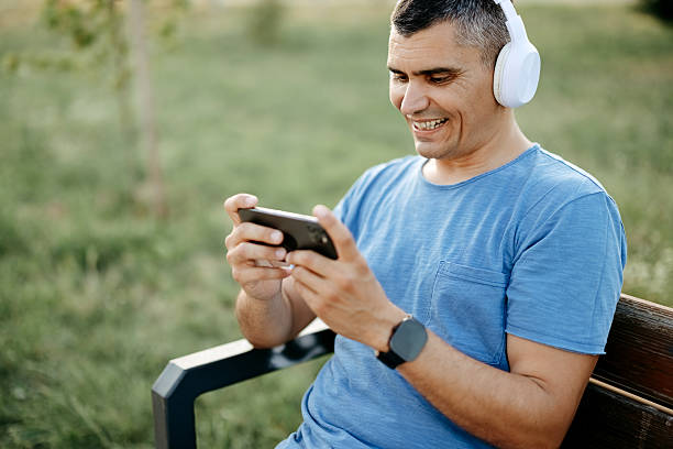 istock Man plays games outdoors 2218801181