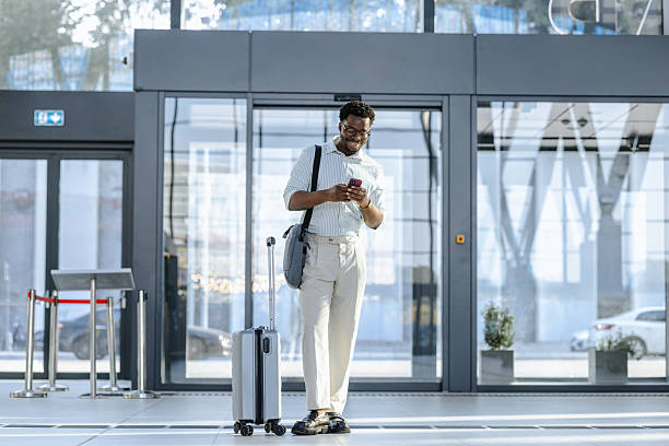 istock Confident professional using smartphone at public station 2218801305