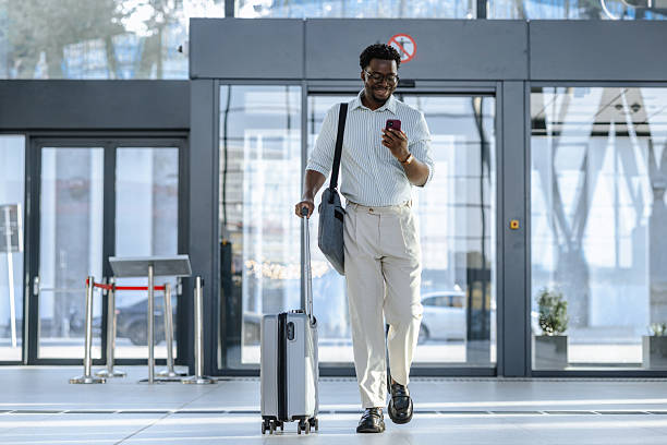 istock Confident professional using smartphone at public station 2218801323
