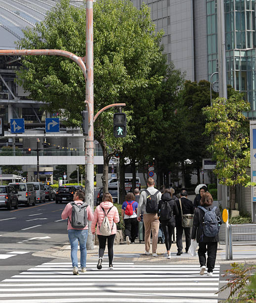 istock Visitors Walk the Crosswalk in Umeda, Osaka, Japan 2218802144