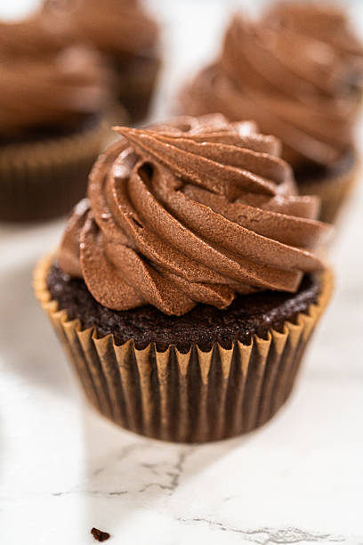 istock Baking Chocolate Cupcakes with Decadent Chocolate Frosting 2218802884
