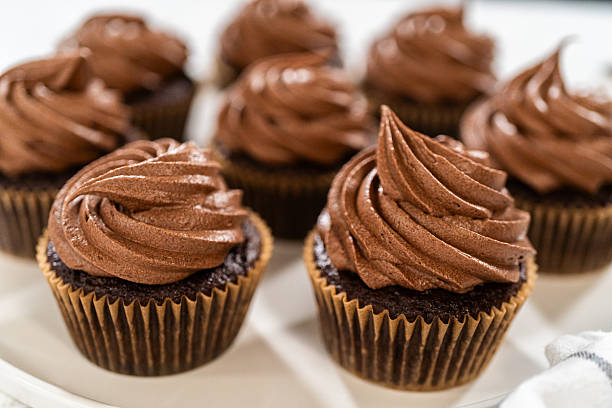 istock Baking Chocolate Cupcakes with Decadent Chocolate Frosting 2218802999