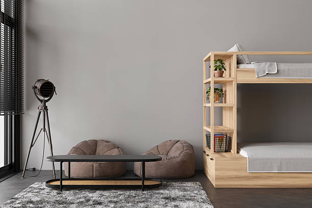 istock This hostel interior showcases a minimalist design with wooden bunk beds, bean bag chairs, and a sleek table. A warm atmosphere invites guests to relax and socialize in comfort 2218805872