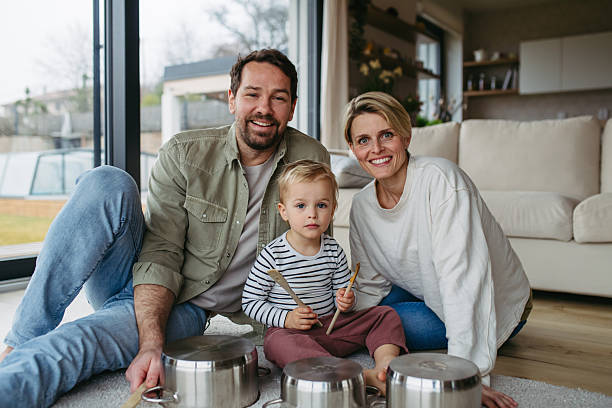 istock Parents and toddler son playing drums on kitchen pots 2218806955