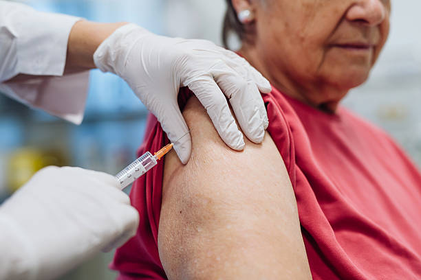istock Elderly patient being vaccinated by doctor. 2218807673
