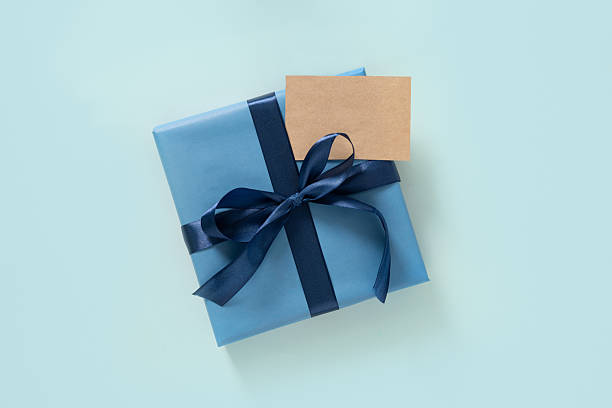 istock Happy Fathers Day gift box and label on blue background. View from above. 2218824407