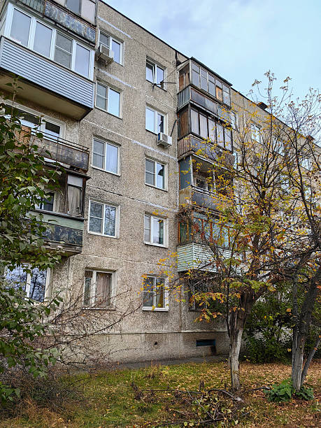 istock A five-storey panel Soviet-build building with glazed balconies against a background of trees with yellow-green leaves and grass. Autumn. Russia. Nizhny Novgorod. Gaugelia Street. October 2024. Photo. 2218826807