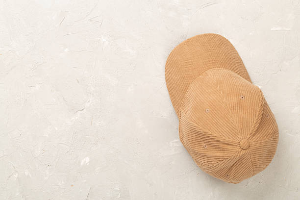 istock Beige velvet cap on concrete background, top view 2218829156