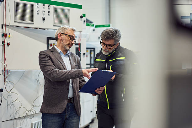 istock Business Discussion Between Professionals in a Modern Industrial Setting 2218829696