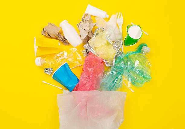istock Bag with unsorted waste on color background, top view 2218831707