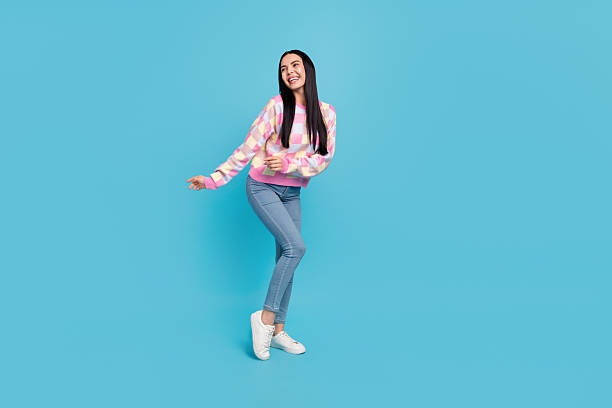 istock Photo of pretty funky lady dressed print pullover dancing empty space isolated blue color background 2218844300