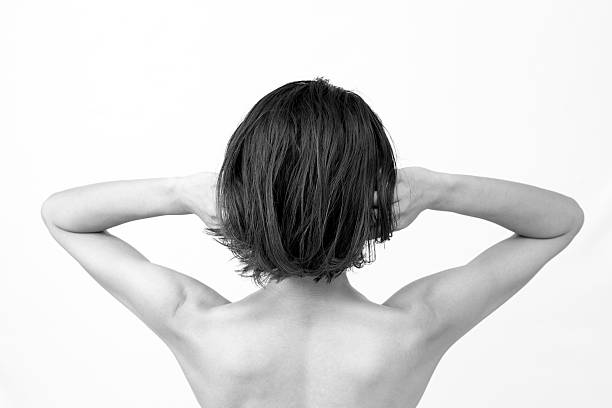 istock A woman brushing her hair back. 2218847193