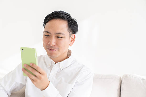 istock young man who uses smart phone 2218849114