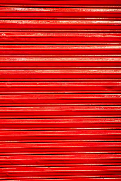 istock Red colored garage door background 2218851295