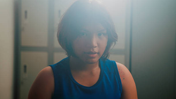 istock Young Asian female boxer feeling confident after preparing and refining her skills. 2218854444