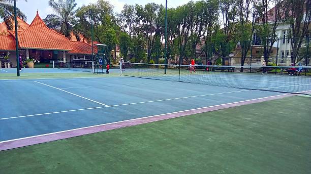 istock Empty Tennis Court Near Trees 2218856181
