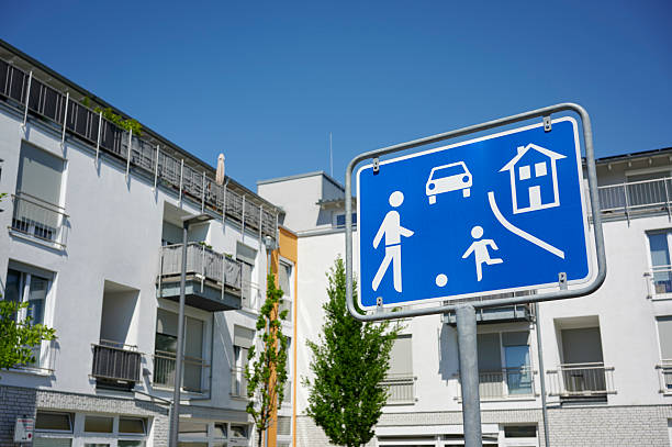 Traffic-calmed area in front of contemporary townhouses, Germany.