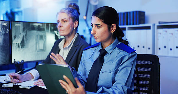 istock Women, security guard or tablet with surveillance for observation or building safety check at office. Female people, officer or investigator team with technology for suspect at protection agency 2218866295