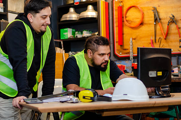 istock Workers or employee working at industrial or factory office with a computer.Two workers at recycle office. 2218869527