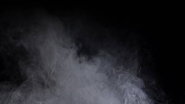 istock Abstract Smoke Wisps on a Dark Background 2218870813