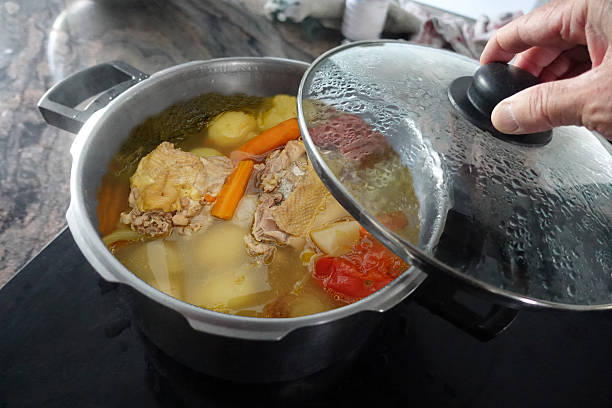 istock Chicken broth cooking in a covered casserole dish 2218871264