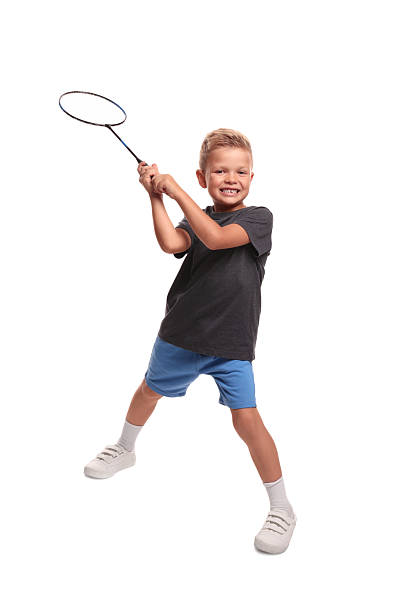 istock Little boy with badminton racket on white background 2218874051