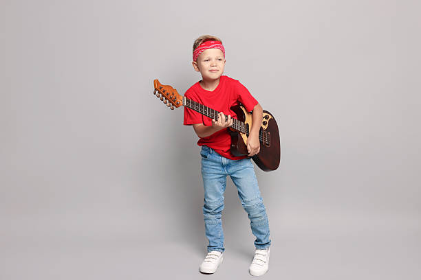 baby playing the guitar