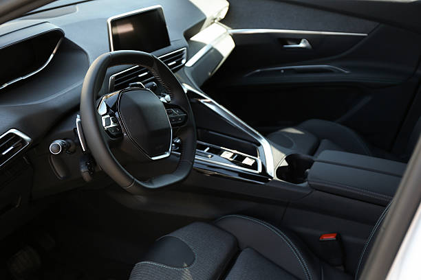 istock Steering wheel and dashboard inside of modern luxury car, closeup 2218874558