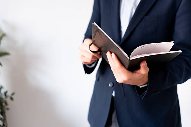 istock Close-up of a planner with work notes. Concept of organization, efficiency, and planning. 2218878401